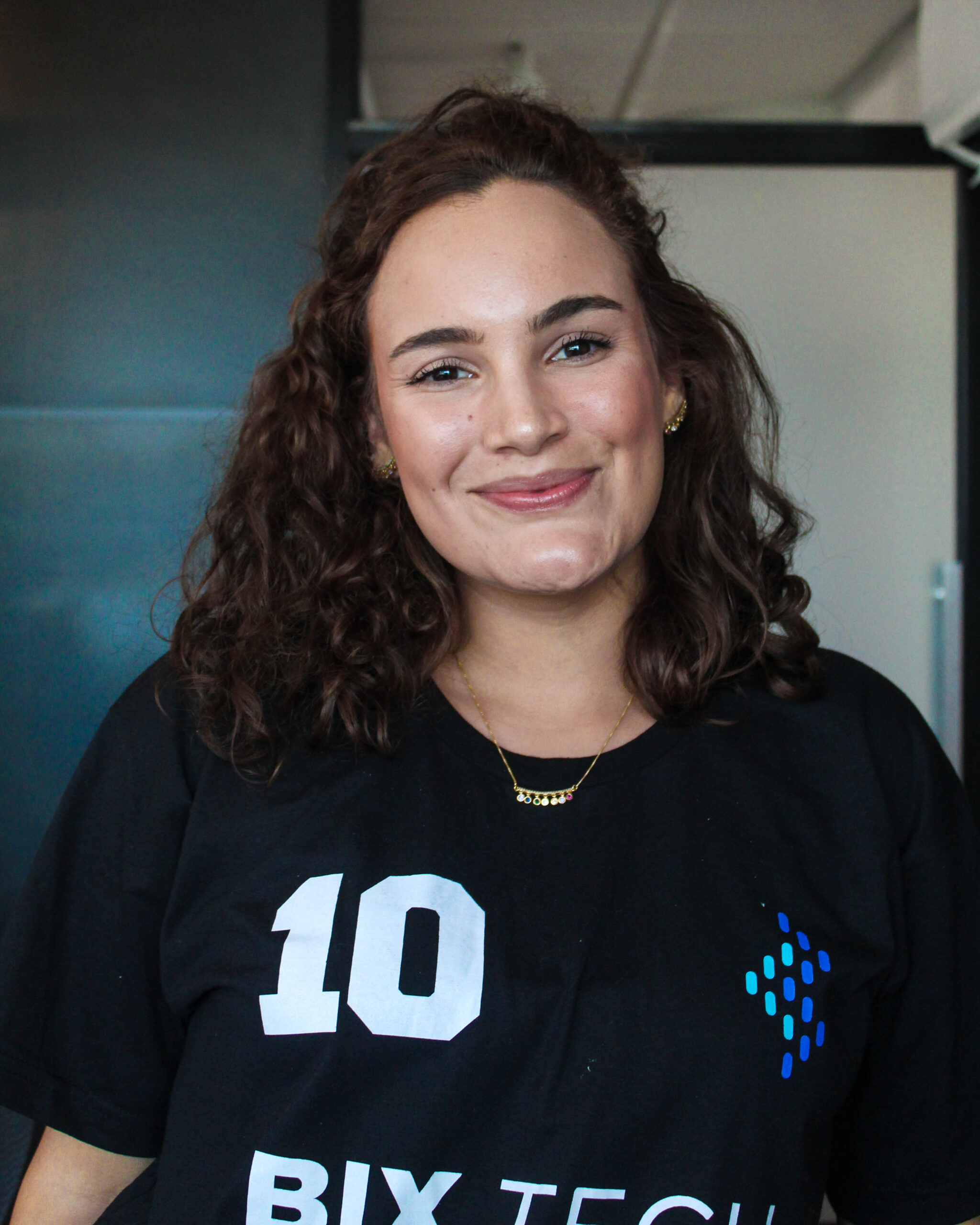 Big smile, long curly hair