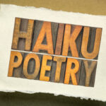 Typographic woodblocks spell out "HAIKU POETRY"