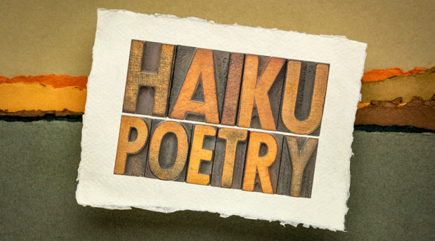 Typographic woodblocks spell out "HAIKU POETRY"