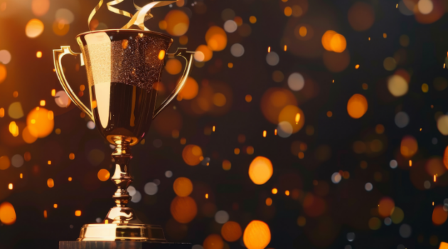 Trophy with sparkling confetti in the background