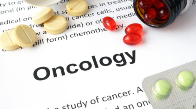 A paper that says "oncology" and several different pills.